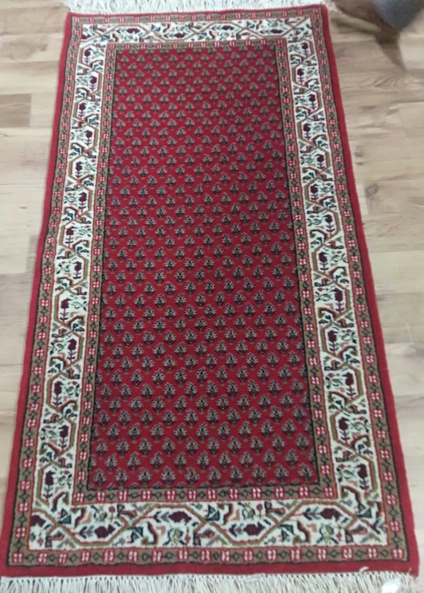 Red and cream hand-knotted wool runner rug
