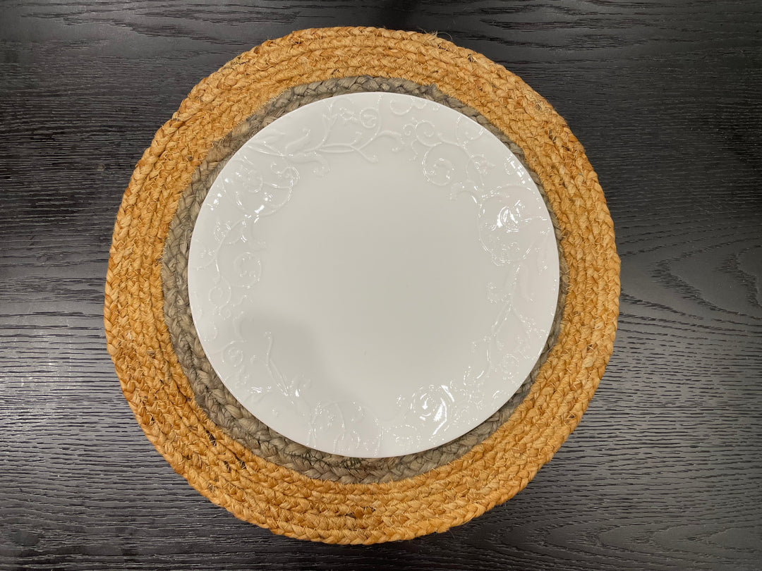 Round jute placemat set styled with dinnerware and glassware, dining table decor