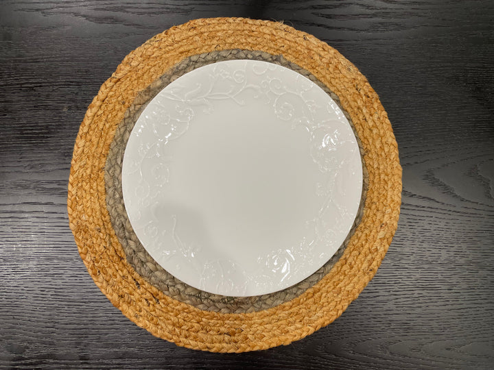Round jute placemat set styled with dinnerware and glassware, dining table decor