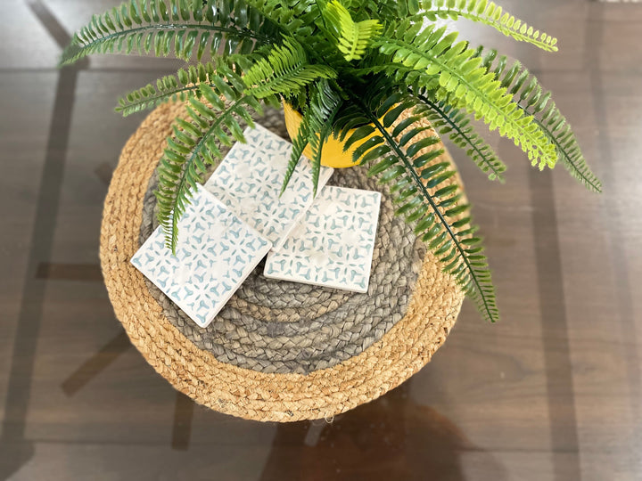 Round handwoven jute placemats under plates, farmhouse style table setting